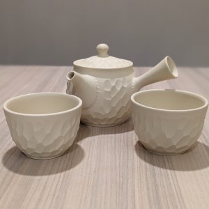 a teapot and two cups